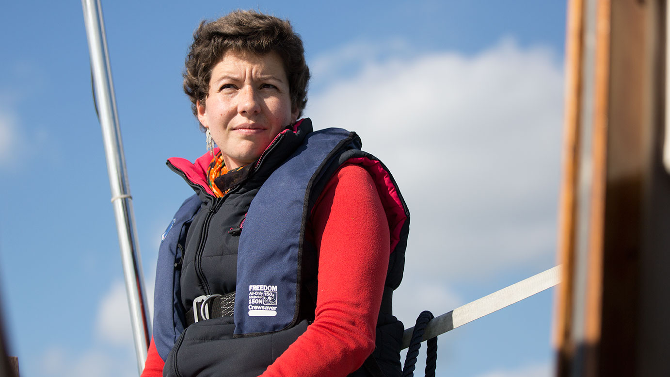 Close-up of Kate looking thoughtful whilst sailing.