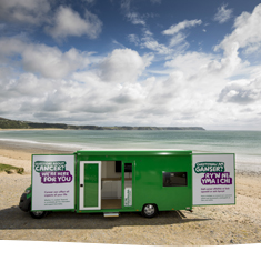 Bronwyn - the mobile cancer information bus on a beach in Wales.