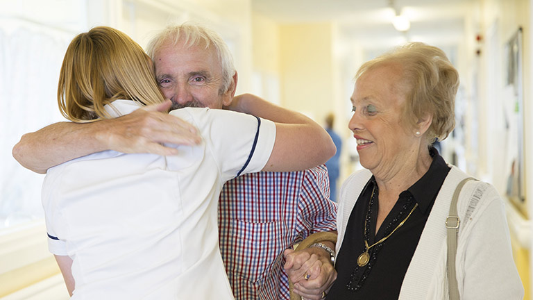 David hugging his Macmillan physiotherapist, Karen.