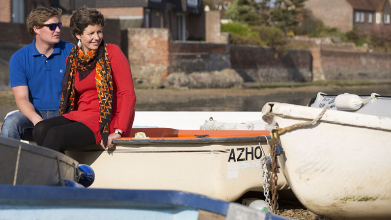 Kate relaxing on a boat with her partner Mark