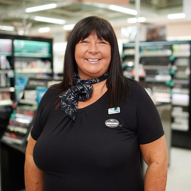 A photograph of a Boots Macmillan Beauty Advisor in a Boots store.
