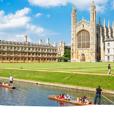 People punting past Trinity College in Cambridge