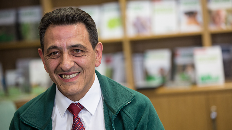 Mario volunteering in an Information Centre