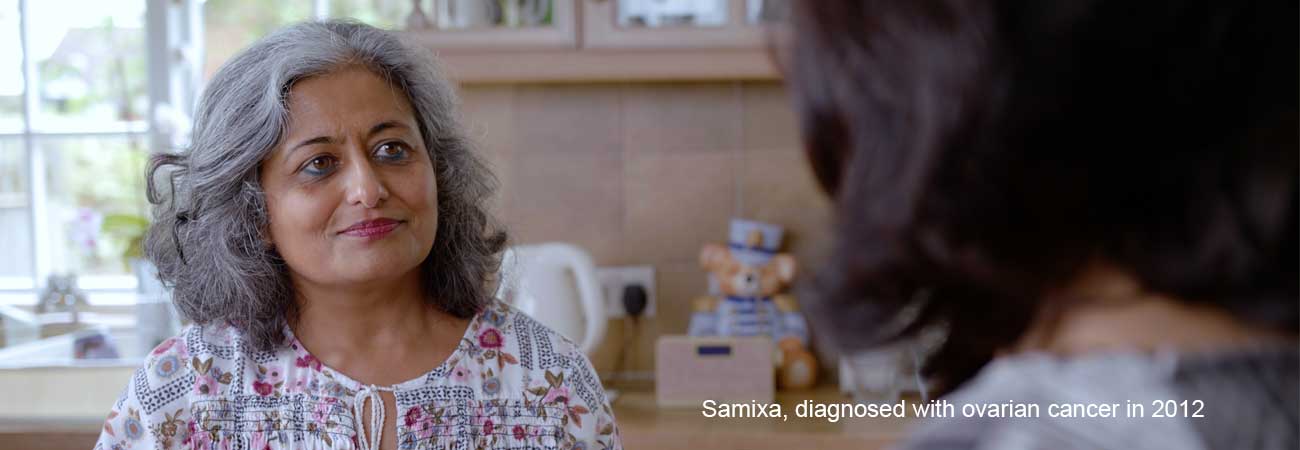 Samixa, diagnosed with ovarian cancer in 2012 sits at her kitchen table