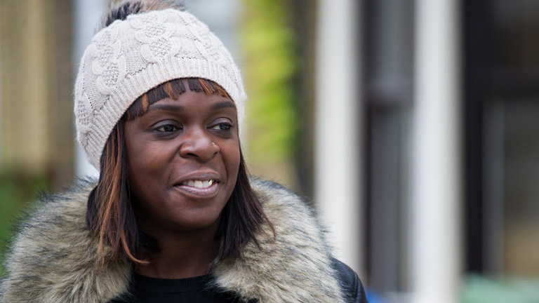 A photograph of Shola smiling