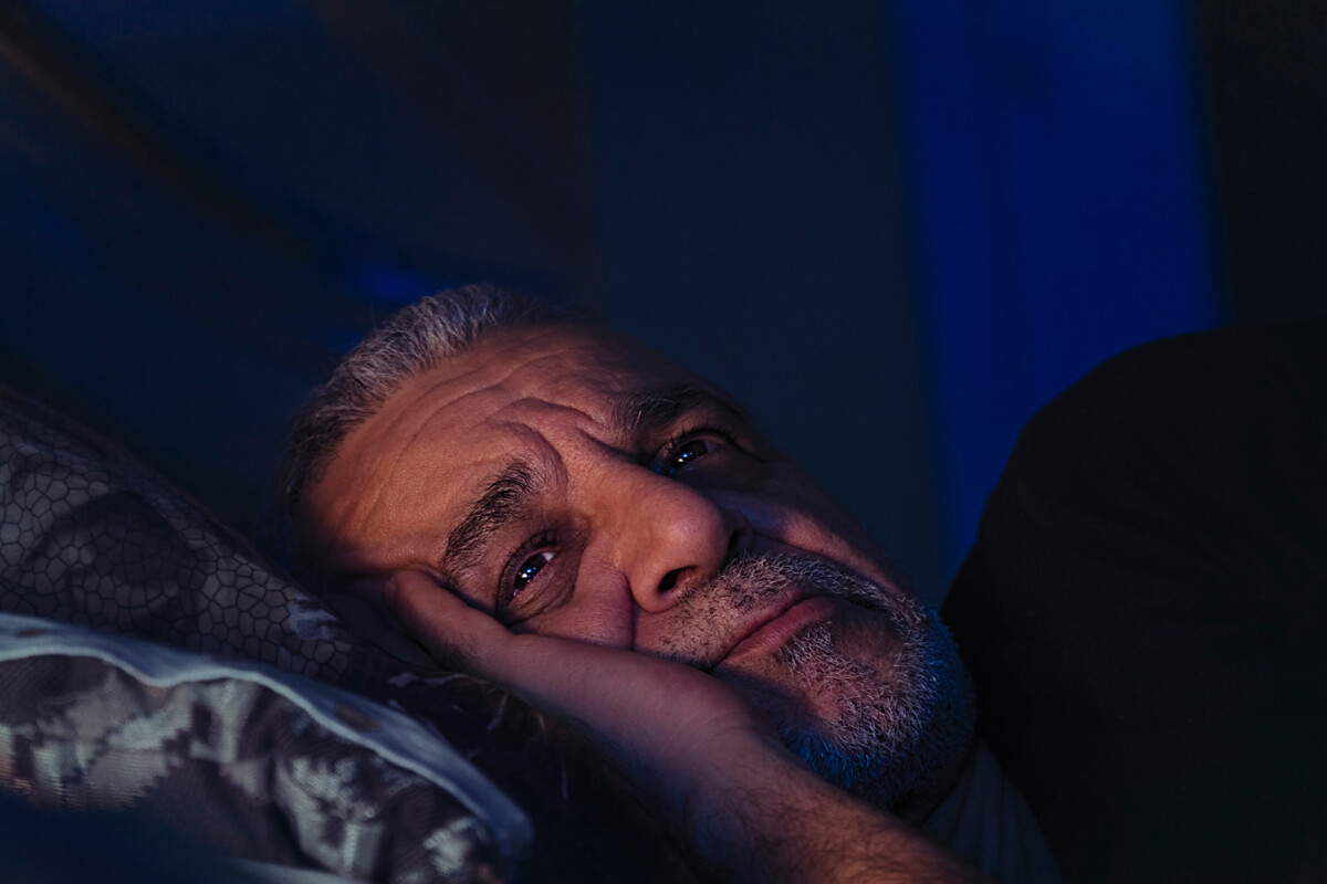 A man lying awake at night