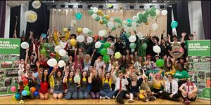 Alva Academy students in their school hall supporting Macmillan