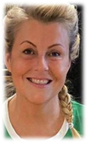 A headshot of Louise. She is smiling at the camera.