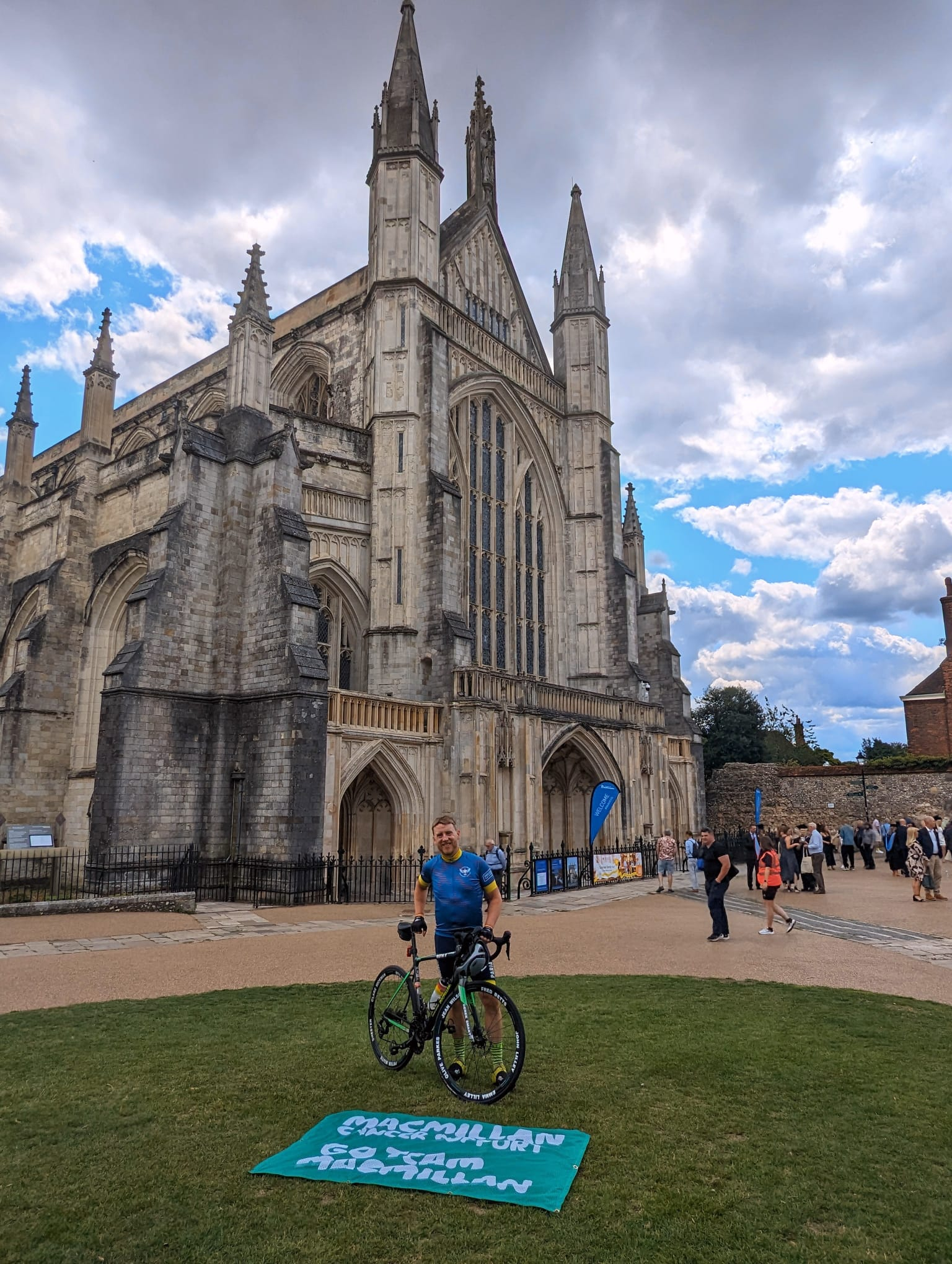 Simon with his bike in front of Winchester Cathedral