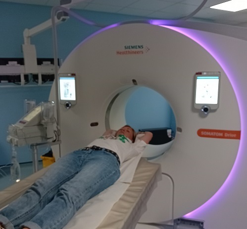 Natasha is lying down to have a MRI scan.