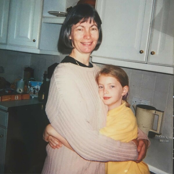 Christen is a young girl and is hugging her mum