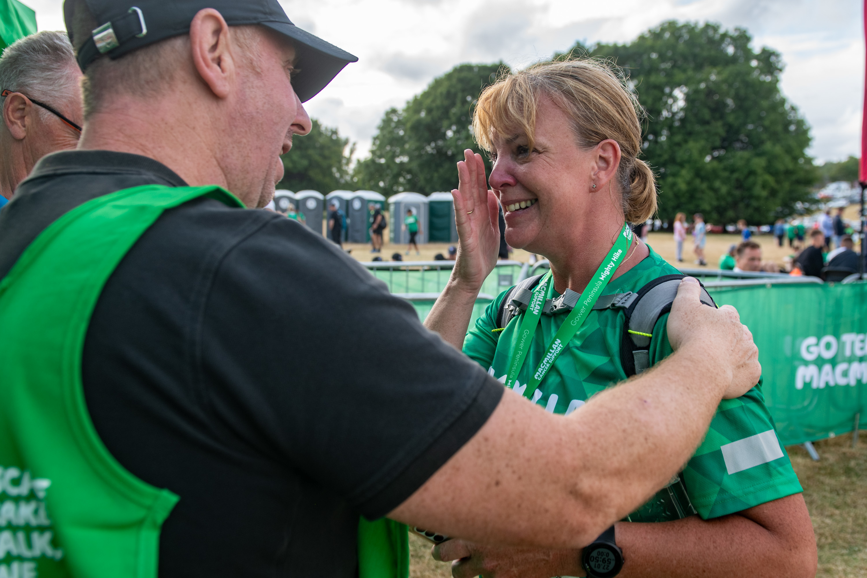 A Mighty Hike volunteer congratulating a finisher