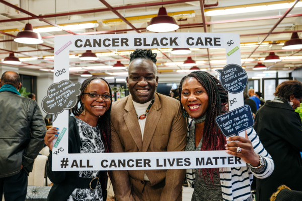 3 black people gathering with Cancer Black Care charity. 