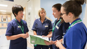 A group of Macmillan nurses in a hospital setting.