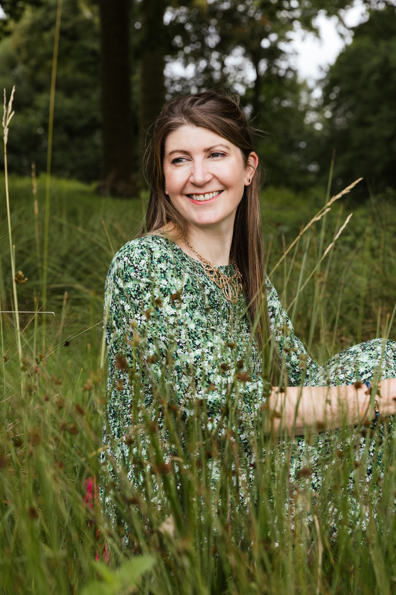 Joanne sitting in the grass