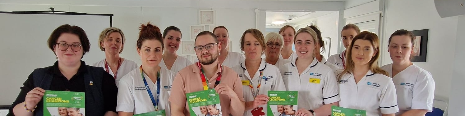 Rainbow Project with healthcare staff holding certificates