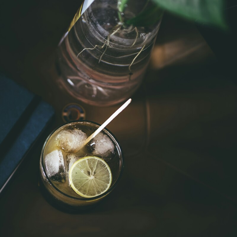 A glass mazagran is served with ice and a slice of lemon. Photo by Sameer Srivastava on Unsplash.