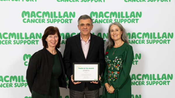 Mark Jackson, runner-up for the Macmillan Thanks to You Award - With Ambition 2025 holding his certificate.