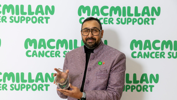 Mohammad Samad winner of the 2025 Macmillan Thanks to You Award - with Strength, holding his award. 