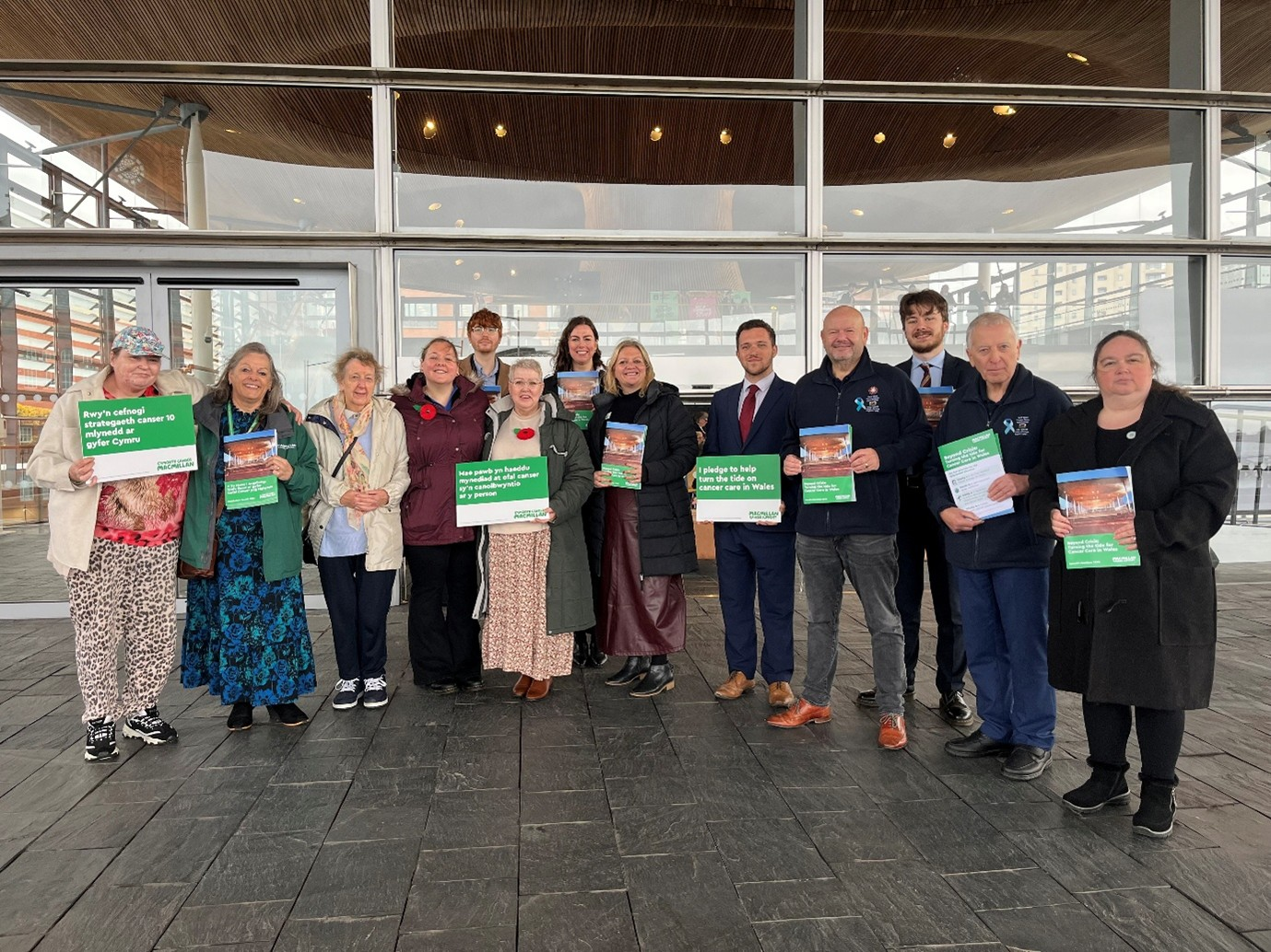 Macmillan Storytellers and professionals together at the Senedd for the launch of Macmillan’s Senedd Elections Manifesto.