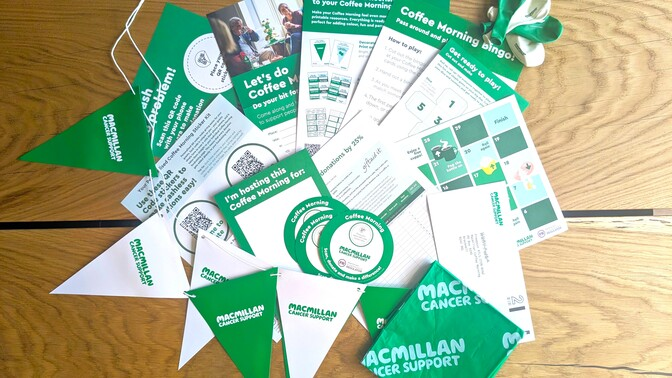 A photo of the Coffee Morning full fundraising kit. It includes a preview of all the different items you will get in your kit such as bunting, balloons, a table cloth,  and more!