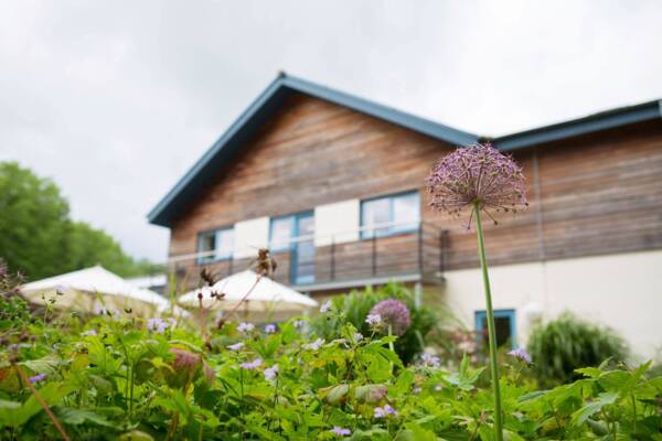  The Longfield Community Hospice building with flowers in the foreground