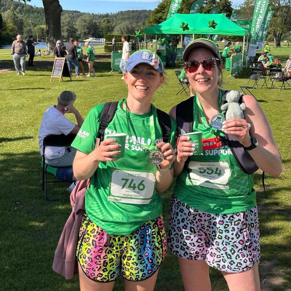 Rachael with a fellow hiker showing off their medals