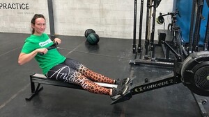 Woman wearing a Macmillan t-shirt on a rowing machine