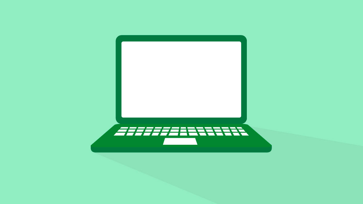 A dark green laptop on a light green background.